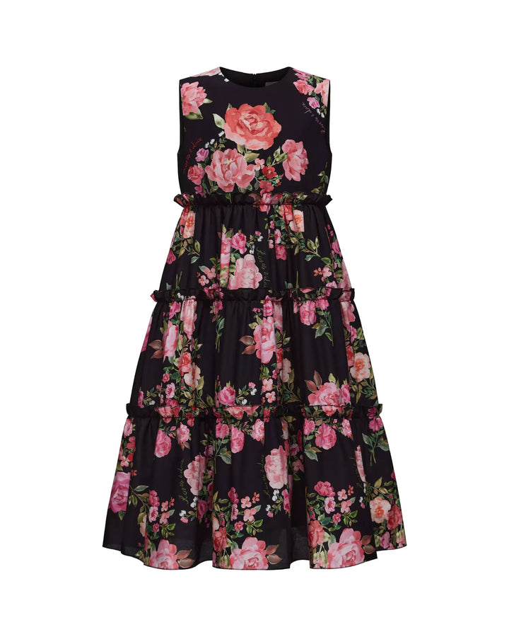 ALISA, A CHILDREN'S DRESS IN BLACK ADORNED WITH MEDIUM-SIZED PINK FLOWERS.