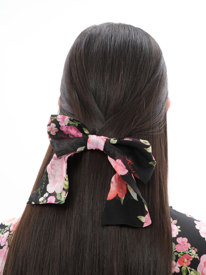 MIRELLA, BLACK BOW HAIR CLIP WITH MEDIUM PINK FLOWERS