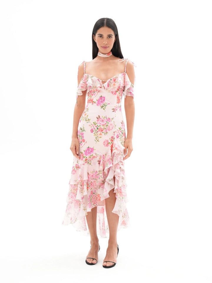 MONICA, A LIGHT PINK MAXI DRESS WITH SHORT SLEEVES AND RUFFLES, ADORNED WITH MEDIUM-SIZED PINK FLOWERS