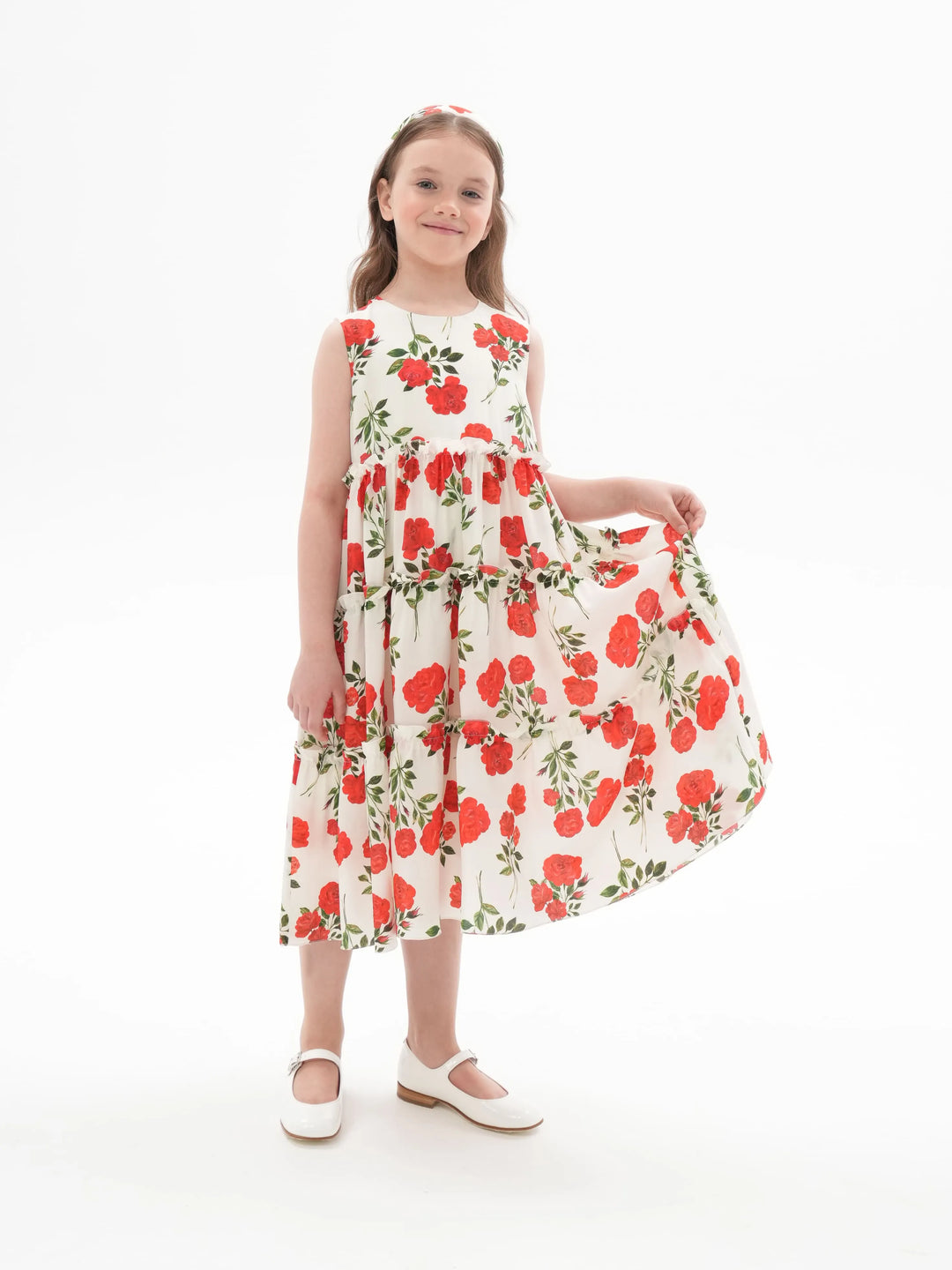 ALISA, A CHILDREN'S DRESS IN CREAMY WHITE WITH MEDIUM-SIZED RED FLOWERS