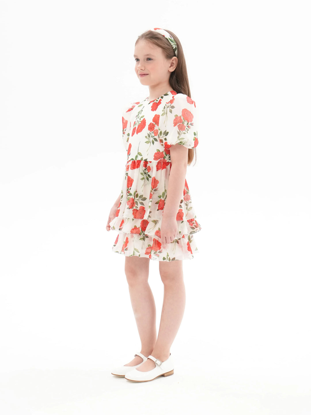 FIFI, A CHILDREN'S DRESS IN CREAMY WHITE WITH MEDIUM-SIZED RED FLOWERS