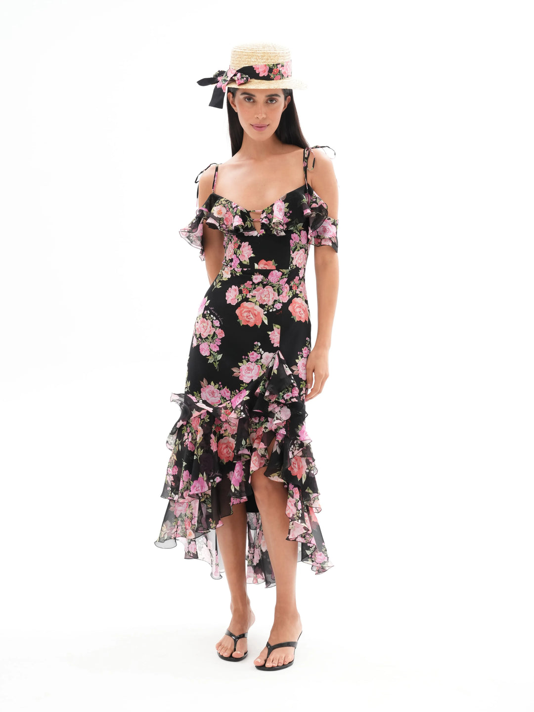 MONICA, A BLACK MAXI DRESS WITH SHORT SLEEVES AND RUFFLES, ADORNED WITH MEDIUM-SIZED PINK FLOWERS