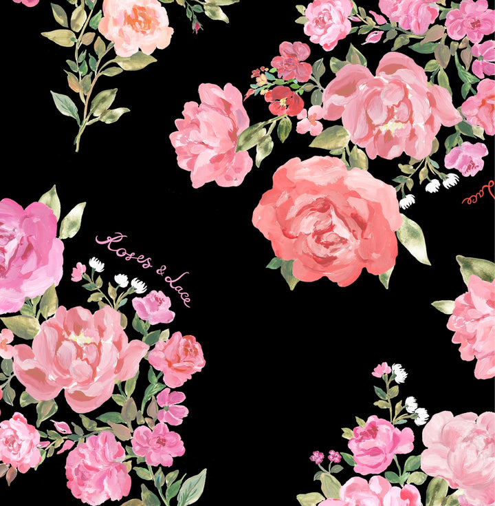 BEATA, A BLACK MIDI DRESS ADORNED WITH MEDIUM-SIZED PINK FLOWERS