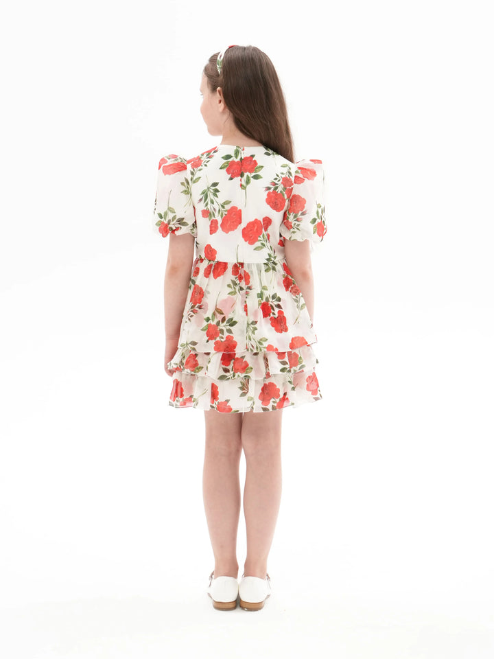 FIFI, A CHILDREN'S DRESS IN CREAMY WHITE WITH MEDIUM-SIZED RED FLOWERS