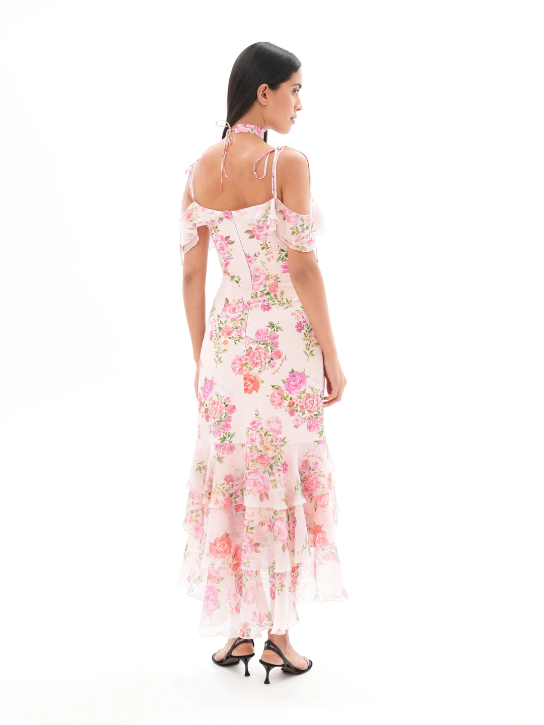 MONICA, A LIGHT PINK MAXI DRESS WITH SHORT SLEEVES AND RUFFLES, ADORNED WITH MEDIUM-SIZED PINK FLOWERS