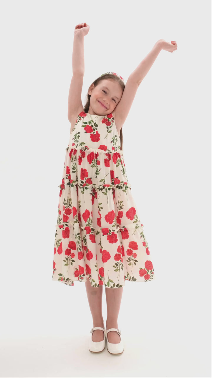 ALISA, A CHILDREN'S DRESS IN CREAMY WHITE WITH MEDIUM-SIZED RED FLOWERS